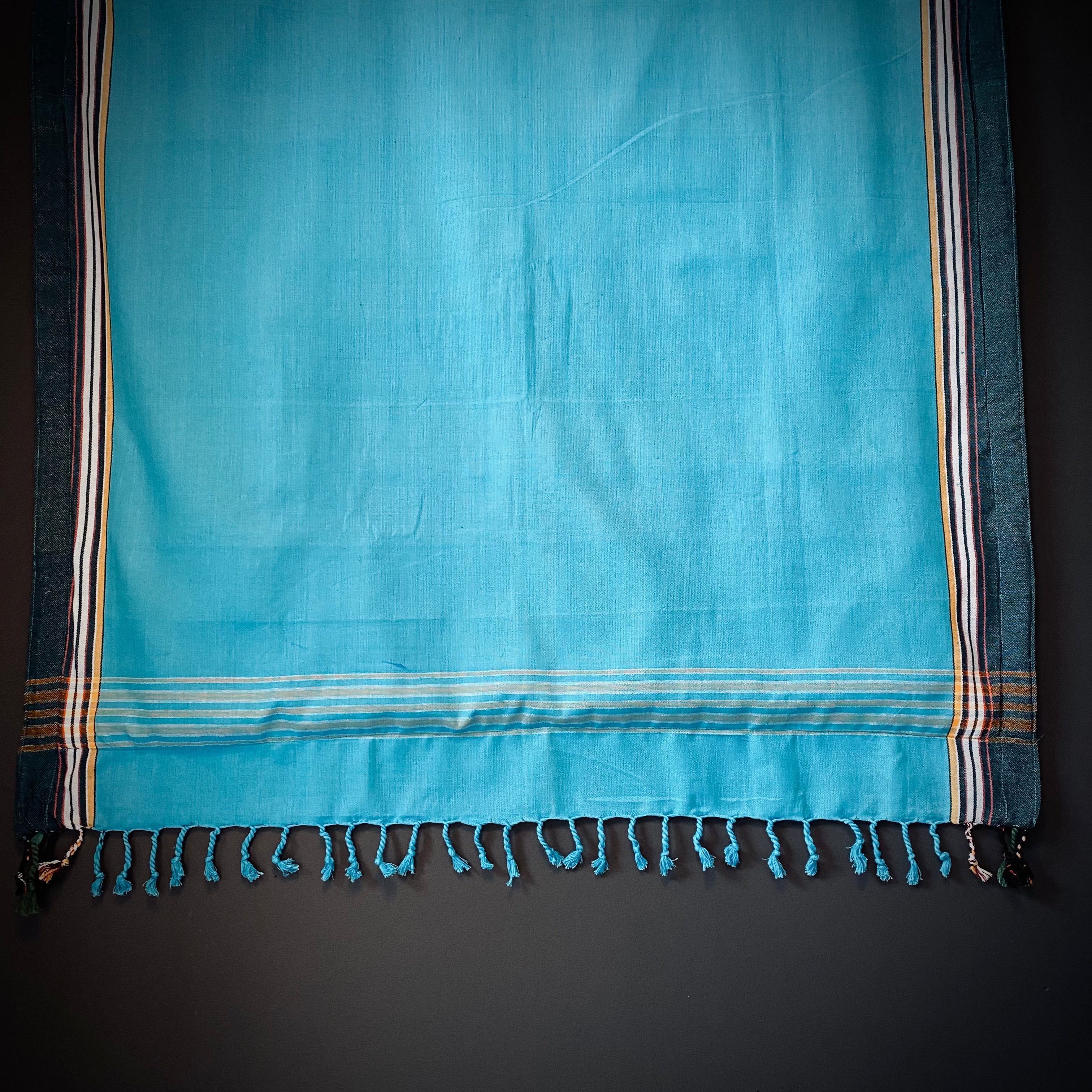 Kikoi Strandtuch one color turquoise with dark frame and light blue towel
