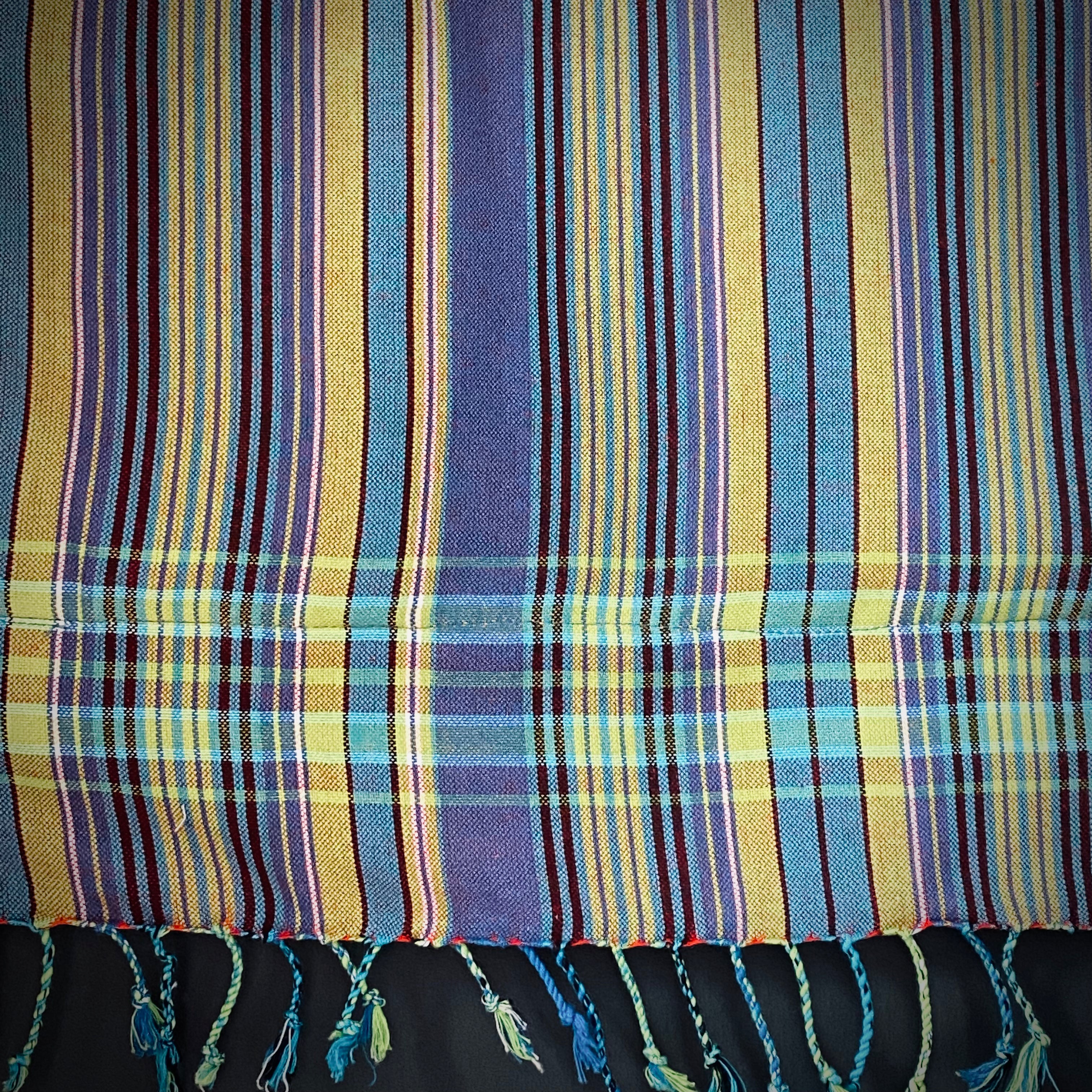 Kikoi Strandtuch with light purple, light green, yellow stripes and light green towel