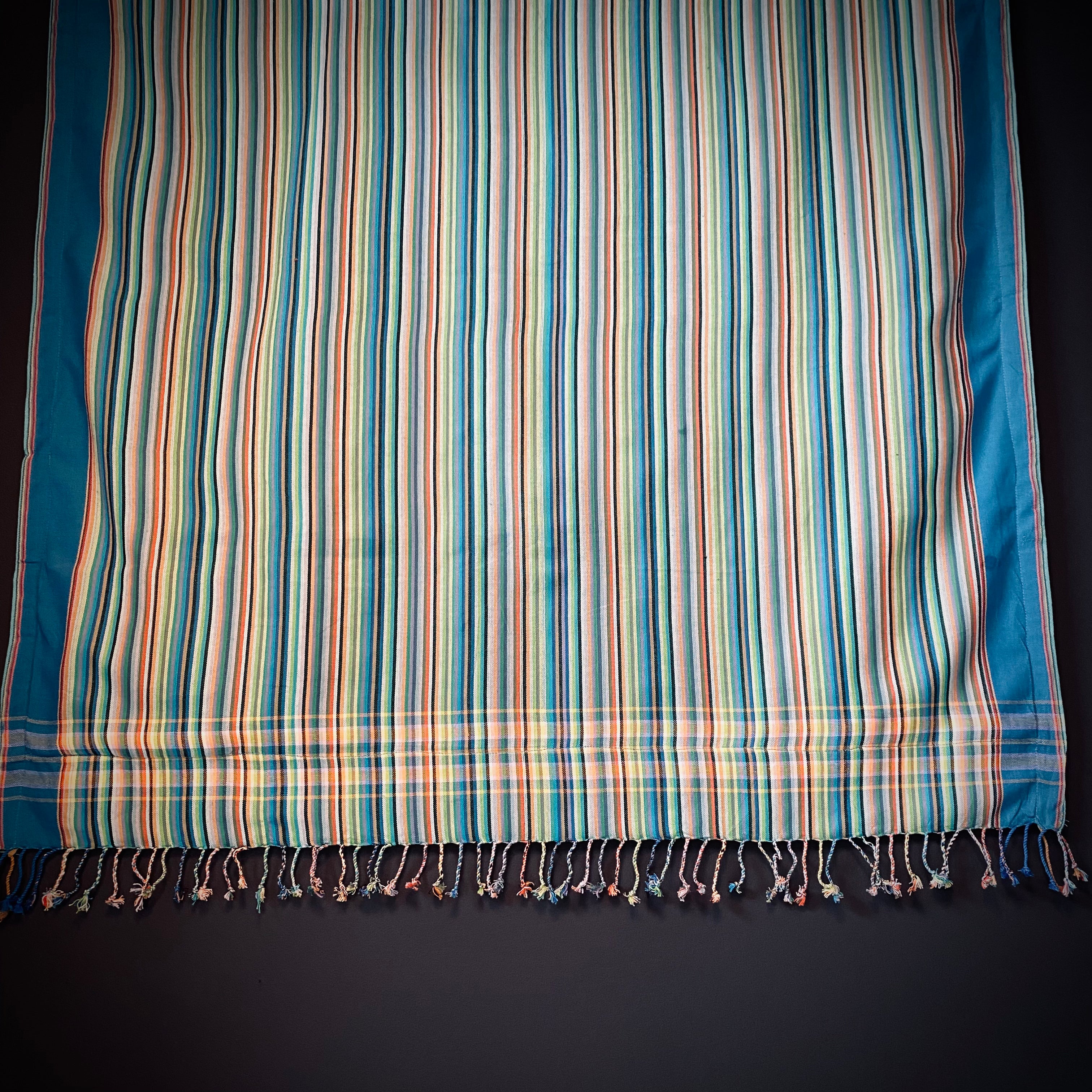 Kikoi Strandtuch with light multicolored stripes and blue towel